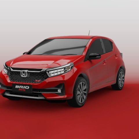 Mobil Honda Brio warna merah untuk disewa di Bali, cocok untuk wisata keluarga kecil.