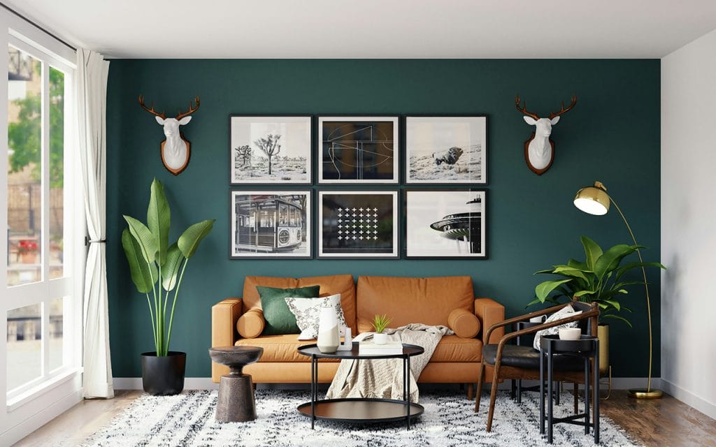 Contoh interior photography ruang tamu modern dengan sofa cokelat, dinding hijau tua, pencahayaan alami, dan dekorasi tanaman hias