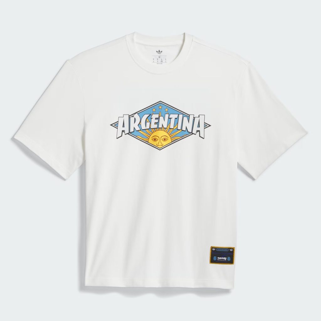 Argentina x Thrasher T-Shirt warna Core White dengan grafis kolaborasi Argentina, Thrasher, dan adidas.