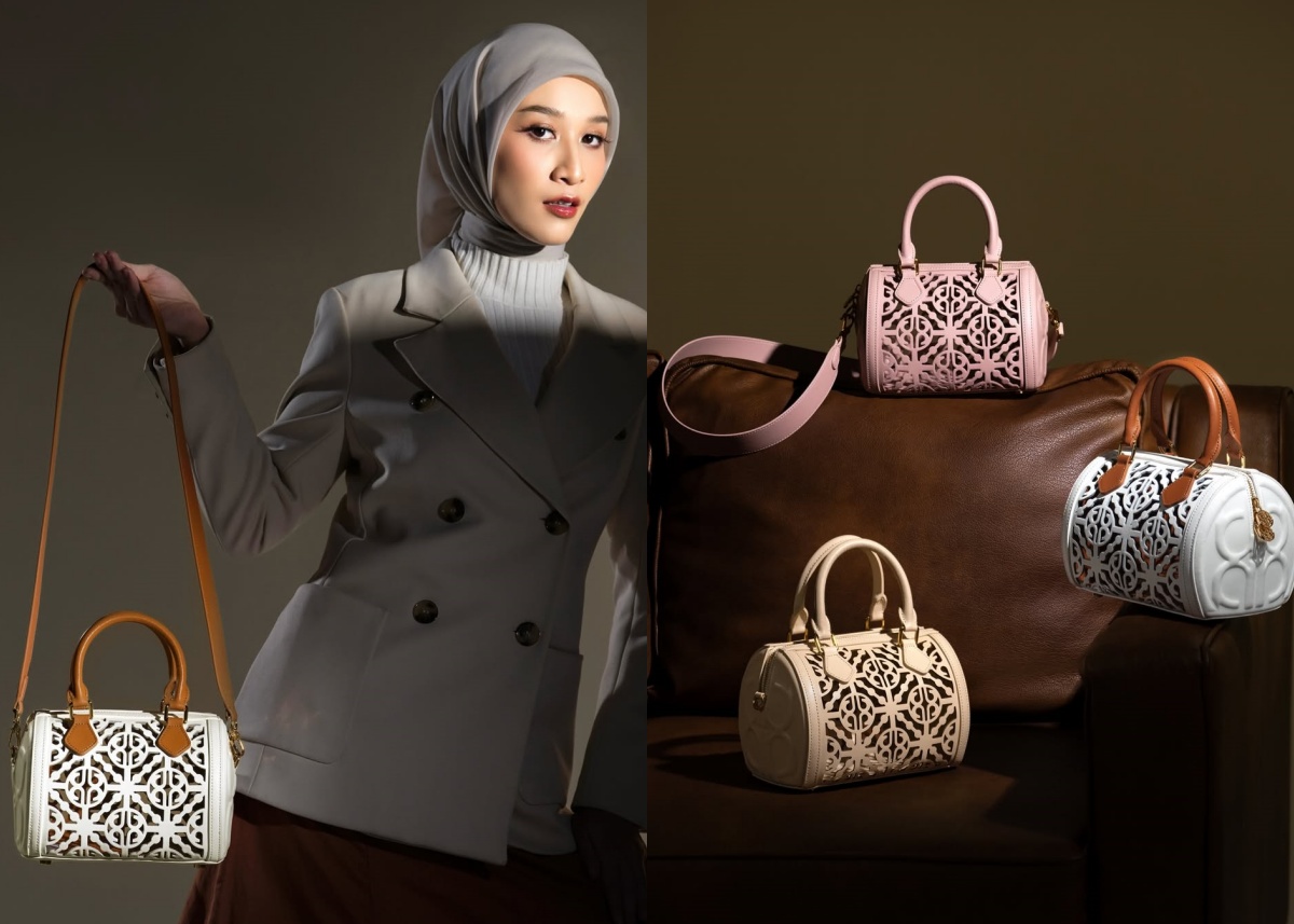 Model wanita mengenakan hijab membawa tas kulit asli dengan desain elegan yang terawat dan tetap terlihat seperti baru.